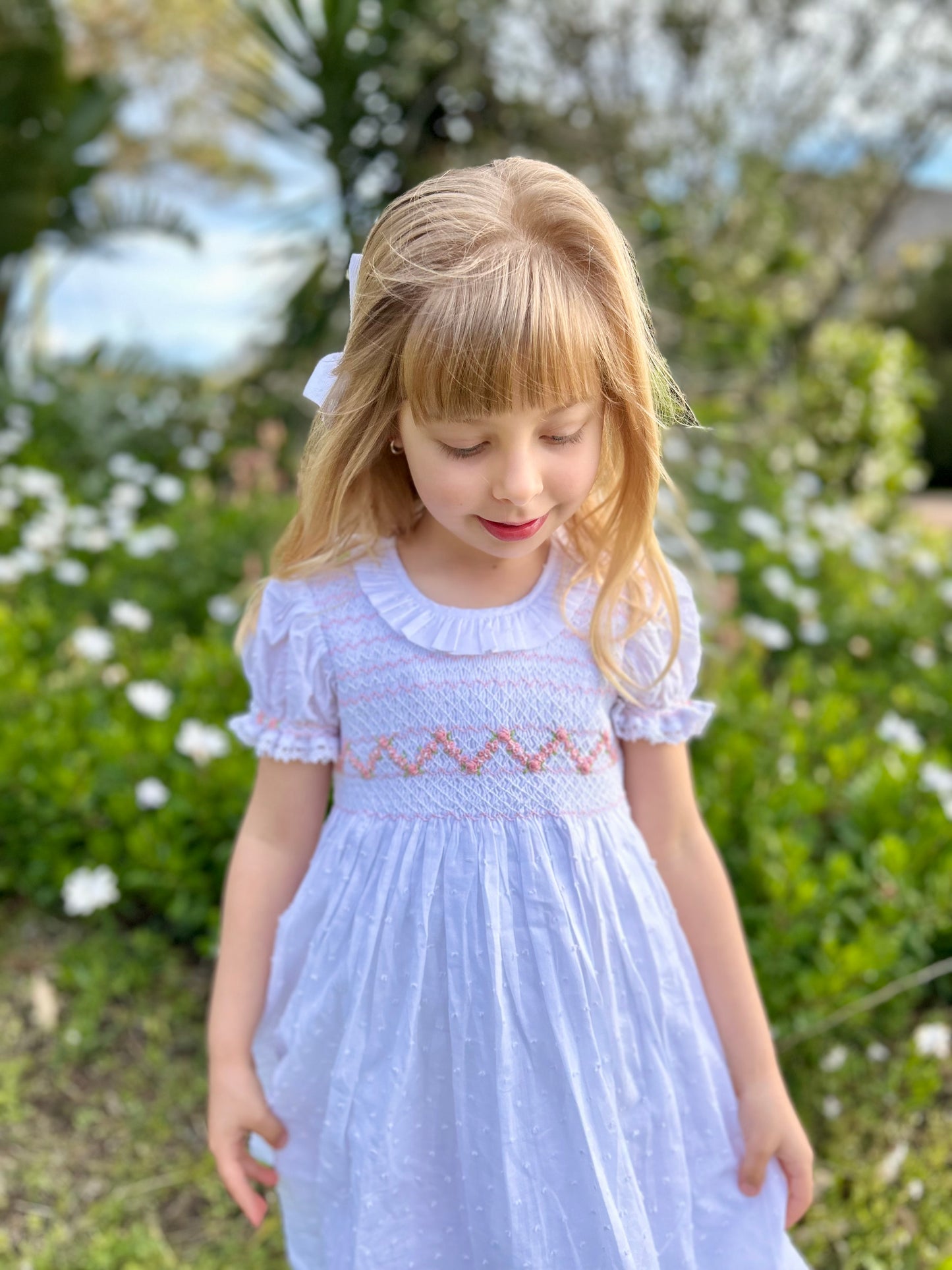 Girls white embroidered dress with light weight fabric and textured pattern