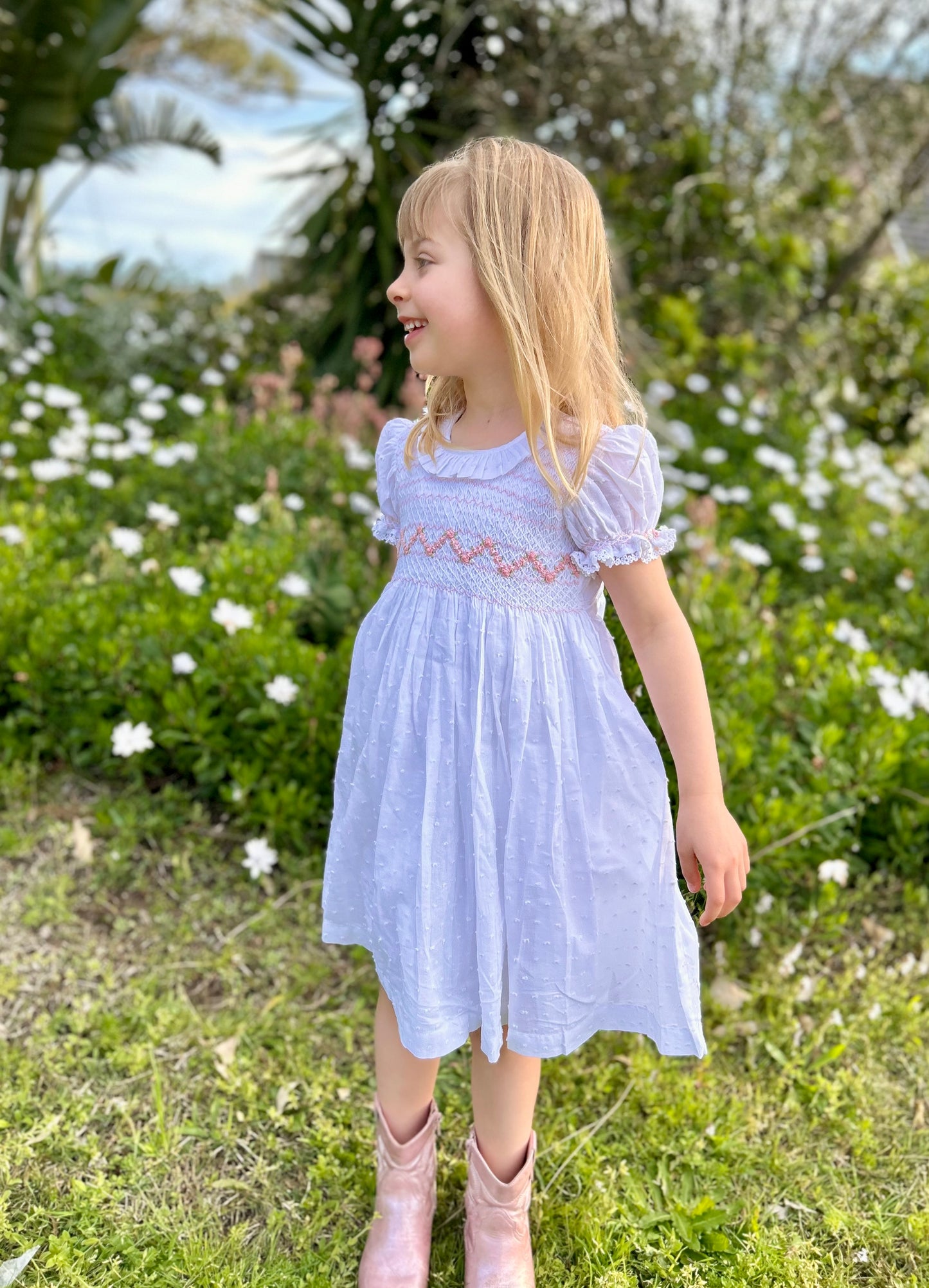 Toddler girl white dress with pink zigzag smocking and puff sleeve design