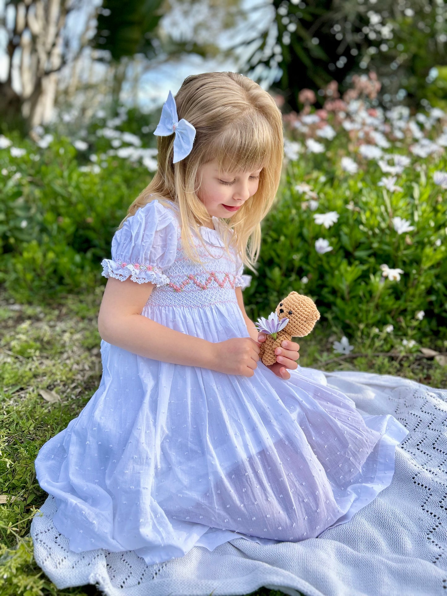 White handmade smocked dress for children with soft pleats and vintage style