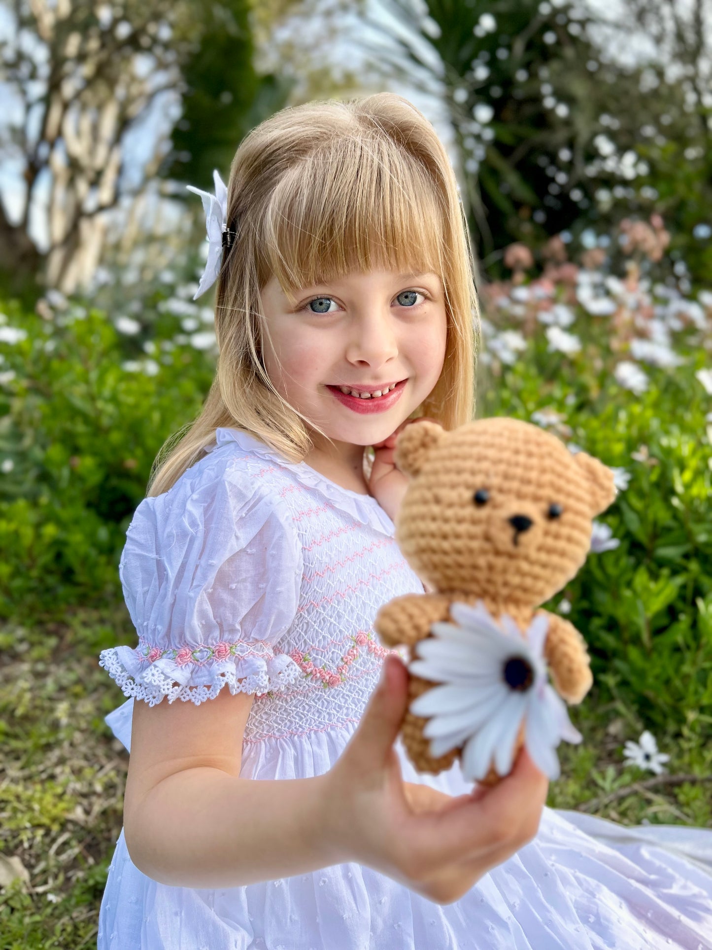 Breathable white dress for girls with delicate smocking and timeless look