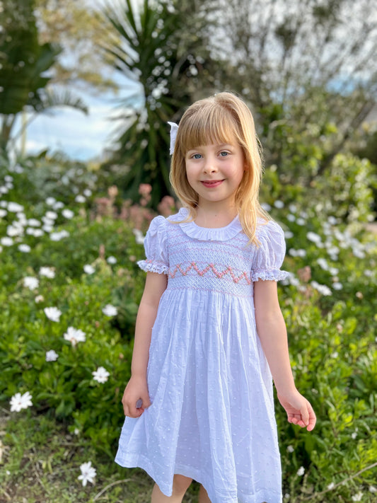 Elegant white cotton dress for toddlers with hand-smocked detailing