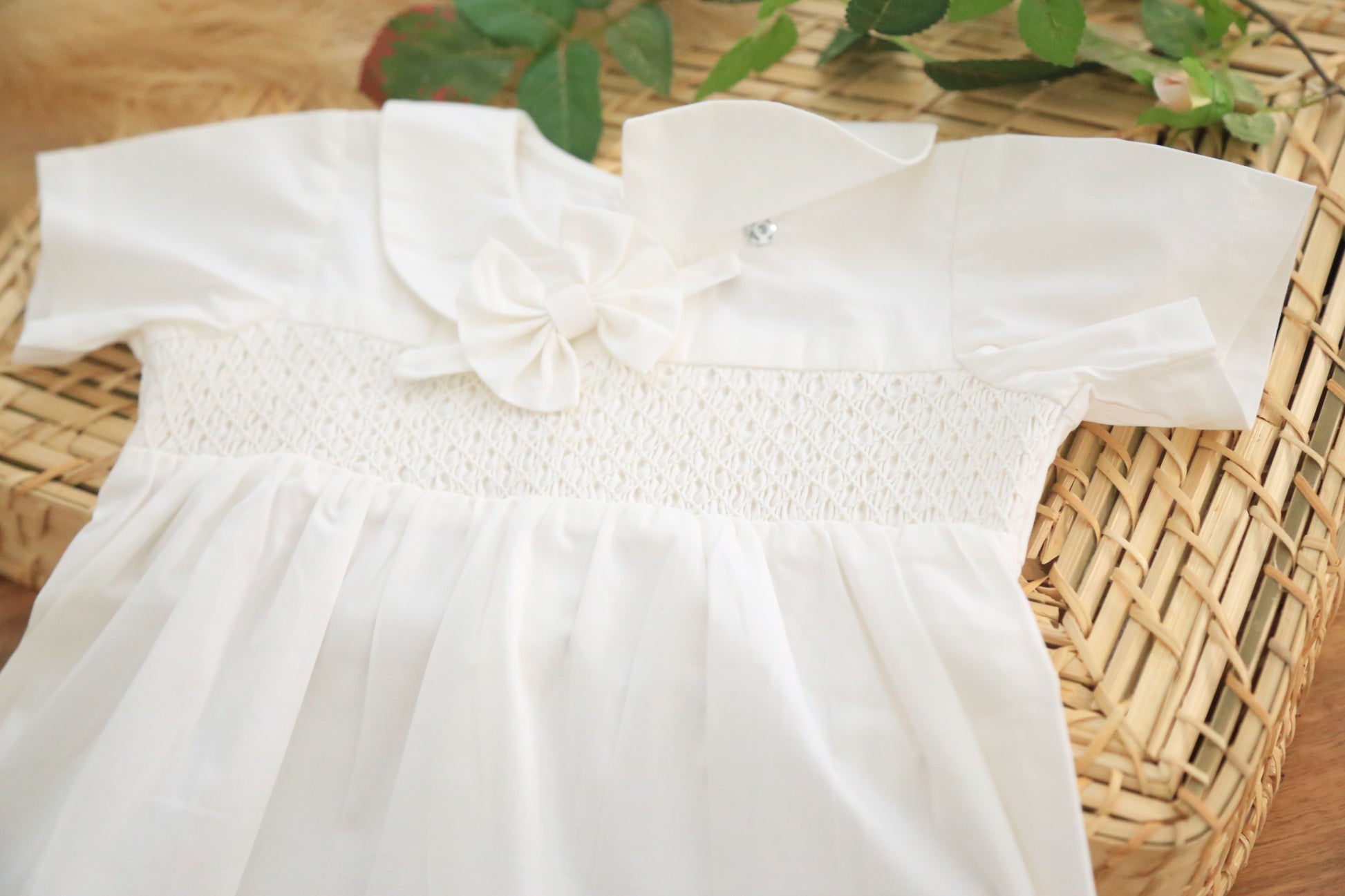 White hand smocked romper for baby boy