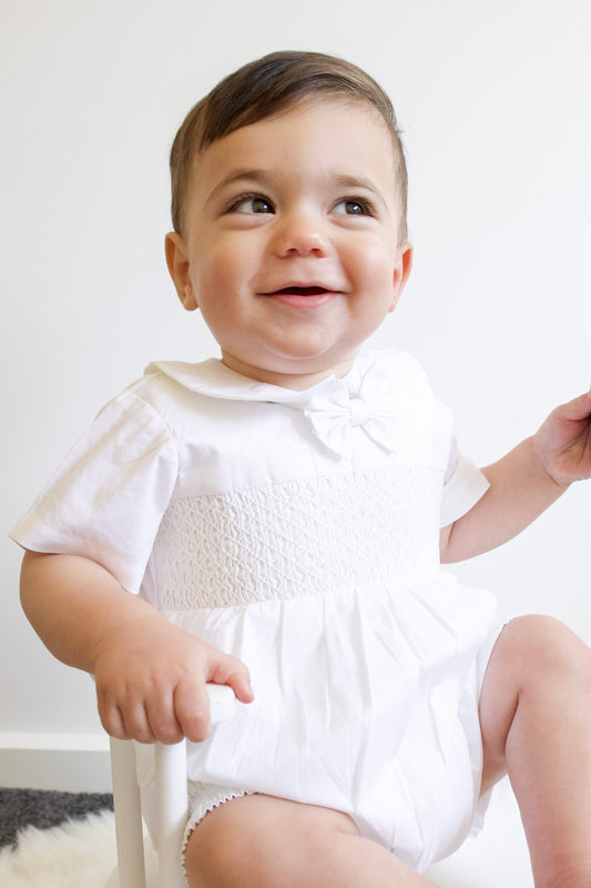 White baby boy hand smocked romper